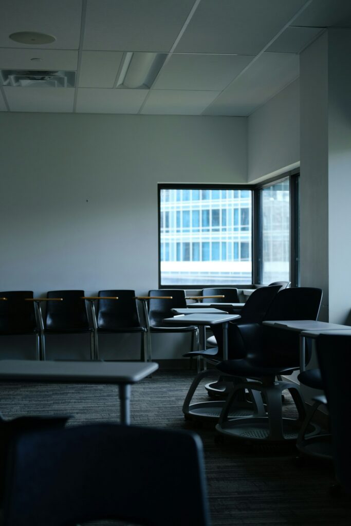 A person sketching a website layout on paper, focused on design elements and structure.